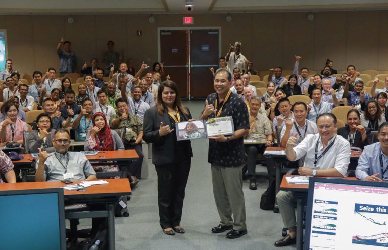 DKI APCSS Director Pete Gumataotao presents Ms. Saira Ali Ahmed with her Alumnae of the Year certificate, shortly after presenting her Fellows project entitled “From Strategy to Reality” to ASC 18-2 in the auditorium.