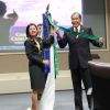 Sr. Col. Kanobsri Gesorn of Thailand and Director Gumataotao add the class streamer to the DKI APCSS flag.